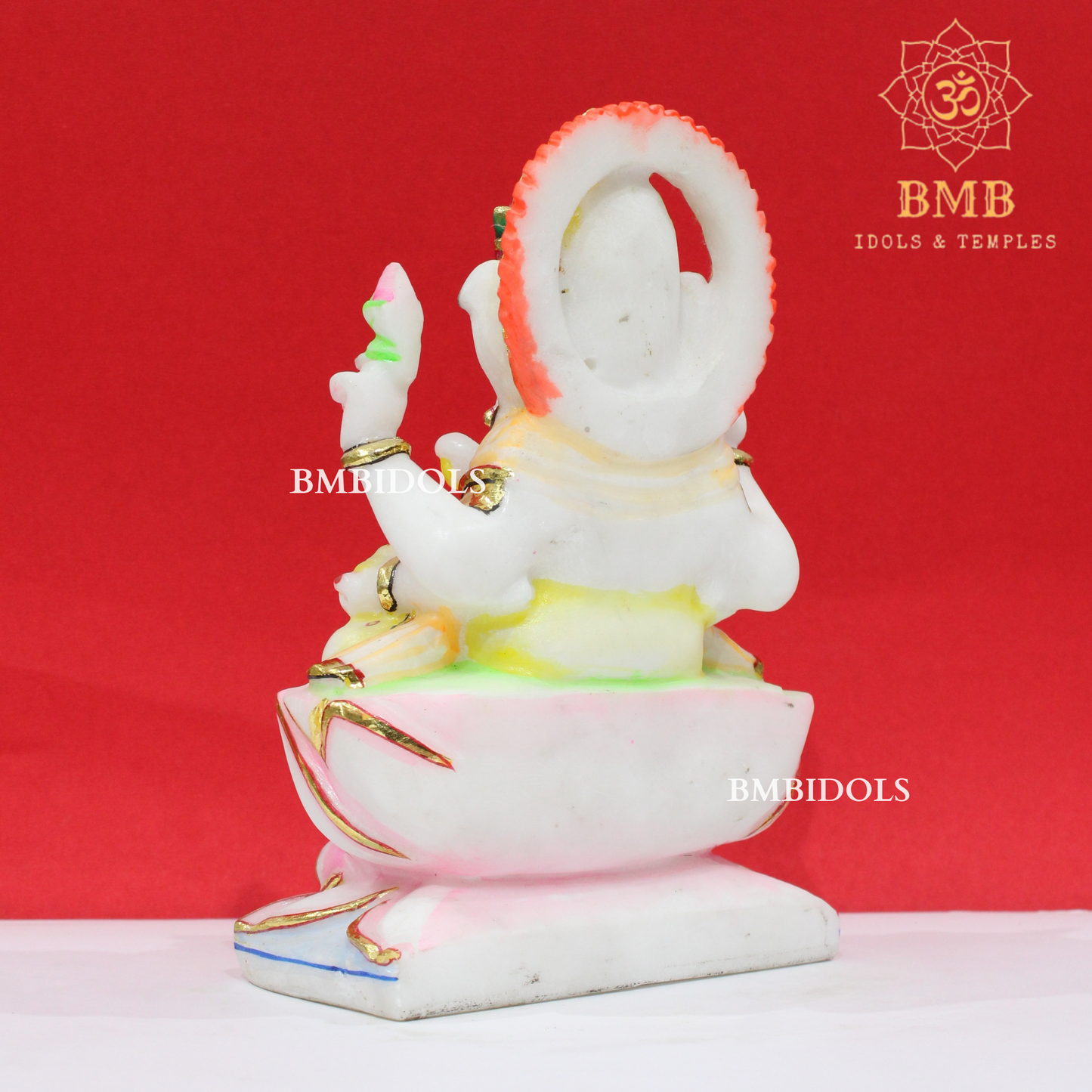 Marble Ganesha Murti sitting on the Lotus with Four Hands