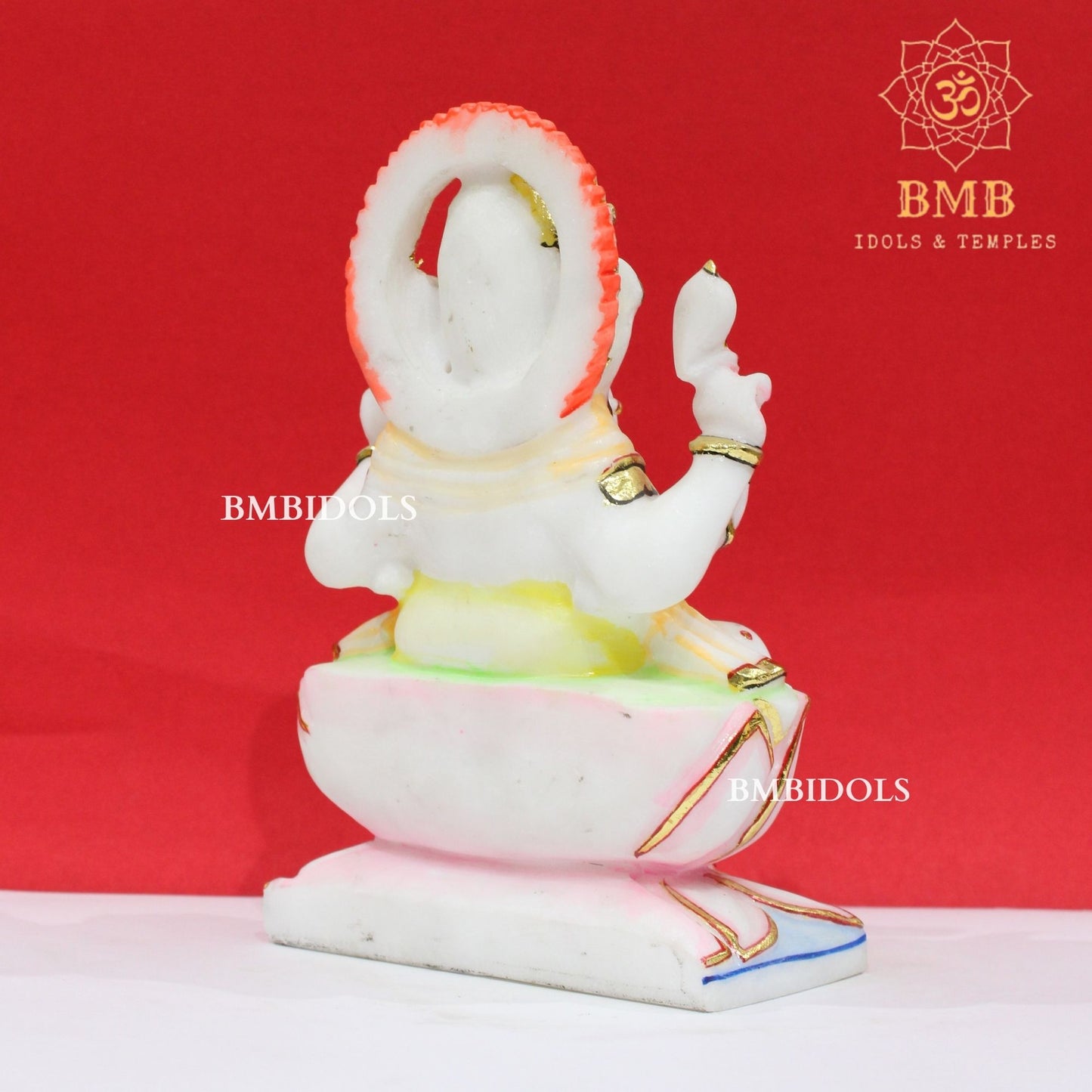 Marble Ganesha Murti sitting on the Lotus with Four Hands