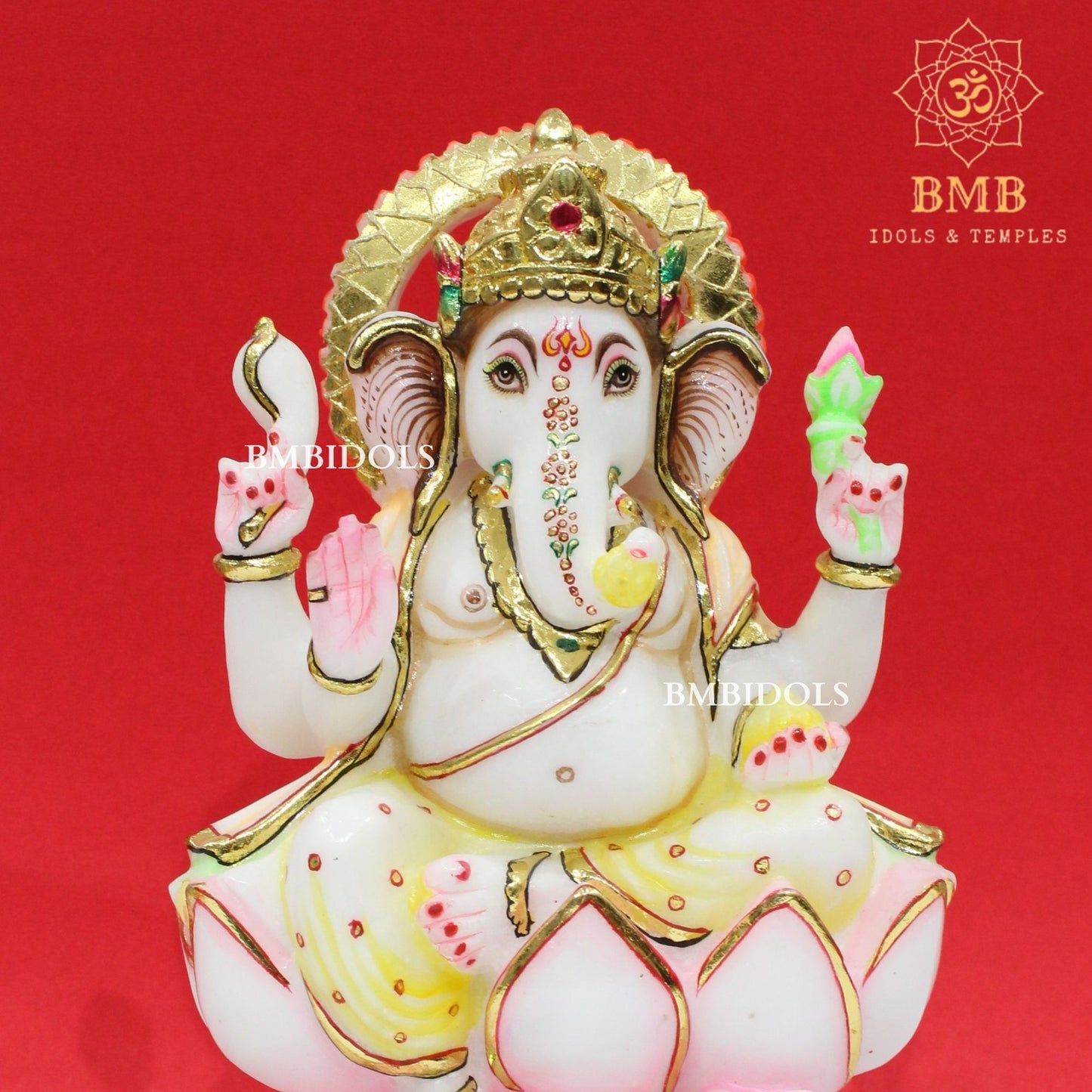 Marble Ganesha Murti sitting on the Lotus with Four Hands
